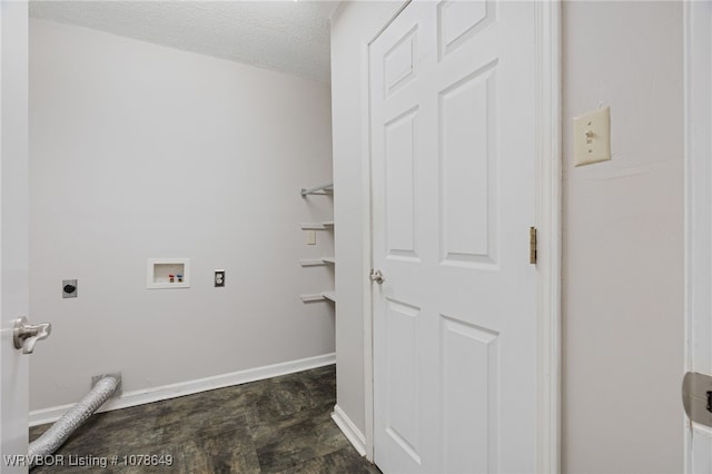 laundry area featuring hookup for a washing machine, a textured ceiling, and electric dryer hookup