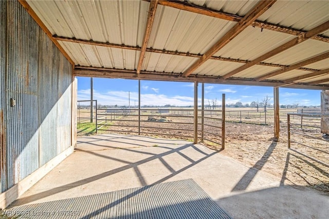 view of patio featuring an outbuilding and an exterior structure