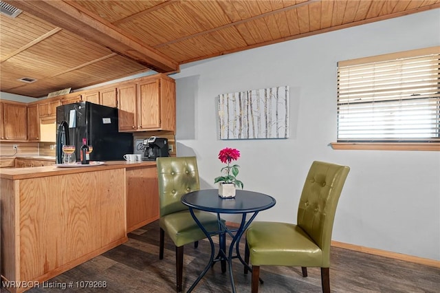 kitchen featuring wood ceiling, dark wood-style flooring, and freestanding refrigerator