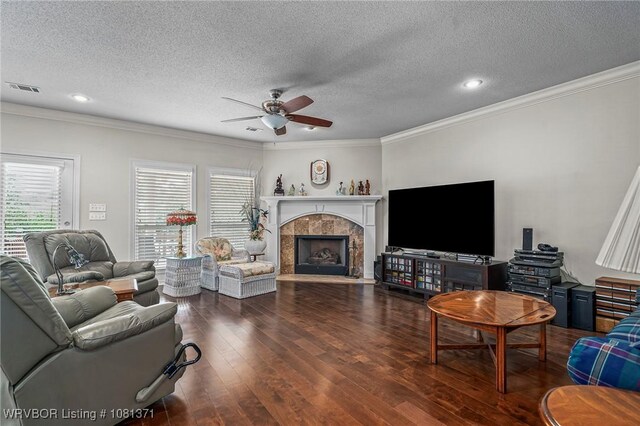 11805 Springridge Dr, Fort Smith, AR 72916 - living area featuring ceiling fan, wood finished floors, a fireplace, crown molding, and a textured ceiling