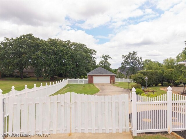 11805 Springridge Dr, Fort Smith, AR 72916 - view of front of property with a fenced front yard, a detached garage, concrete driveway, and a gate