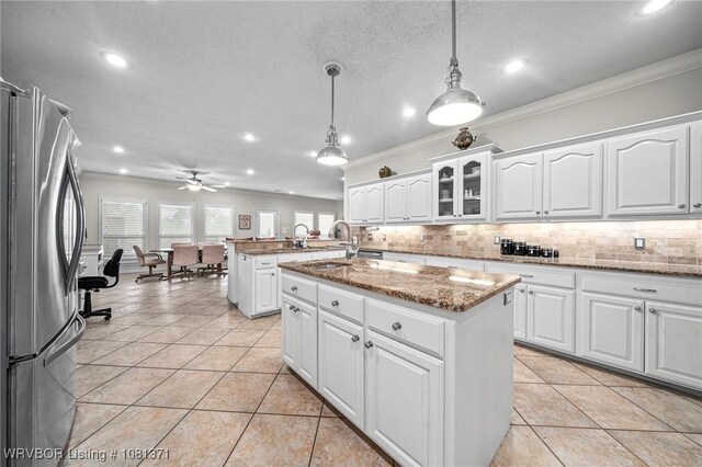 11805 Springridge Dr, Fort Smith, AR 72916 - kitchen with freestanding refrigerator, ornamental molding, recessed lighting, backsplash, and a peninsula