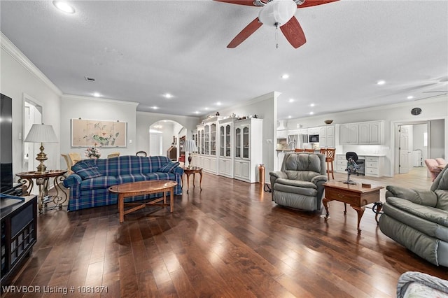 11805 Springridge Dr, Fort Smith, AR 72916 - living room featuring arched walkways, ornamental molding, ceiling fan, dark wood-style flooring, and recessed lighting
