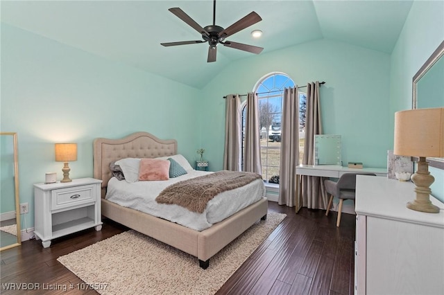 bedroom with lofted ceiling, dark wood-type flooring, and ceiling fan