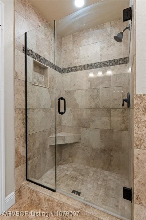 full bathroom with a shower stall