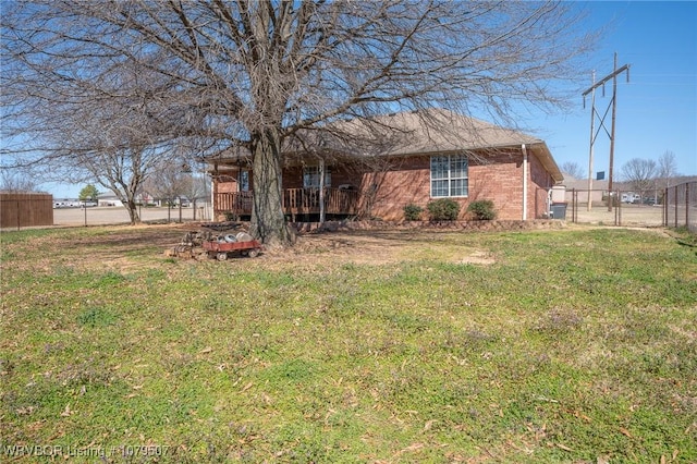 exterior space with a wooden deck and fence