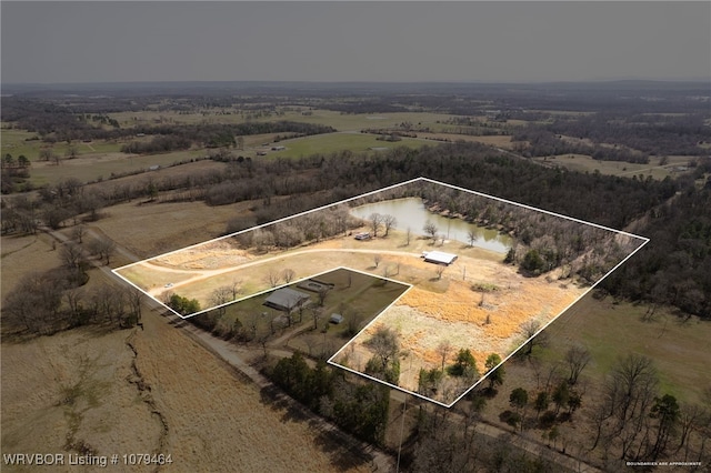 birds eye view of property with a rural view