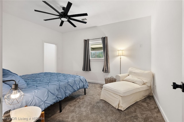 carpeted bedroom with visible vents, baseboards, and a ceiling fan