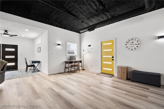 entrance foyer featuring ceiling fan, baseboards, and wood finished floors