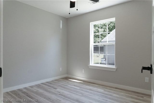 406 N 23rd St, Van Buren, AR 72956 - unfurnished room with a ceiling fan, light wood-style floors, and baseboards