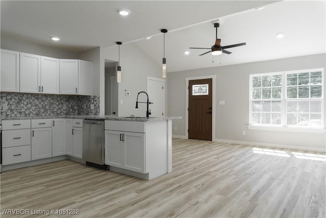 406 N 23rd St, Van Buren, AR 72956 - kitchen featuring stainless steel dishwasher, a peninsula, a ceiling fan, open floor plan, and vaulted ceiling
