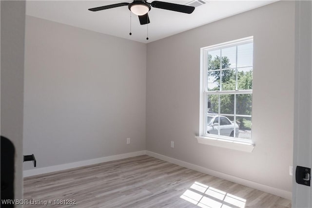 406 N 23rd St, Van Buren, AR 72956 - empty room featuring light wood finished floors, ceiling fan, and baseboards