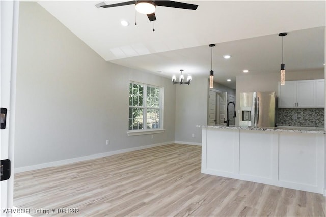 406 N 23rd St, Van Buren, AR 72956 - unfurnished living room featuring a ceiling fan, light wood finished floors, a chandelier, baseboards, and recessed lighting