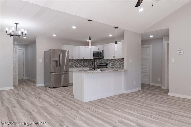 406 N 23rd St, Van Buren, AR 72956 - kitchen with appliances with stainless steel finishes, backsplash, light wood-type flooring, a ceiling fan, and recessed lighting