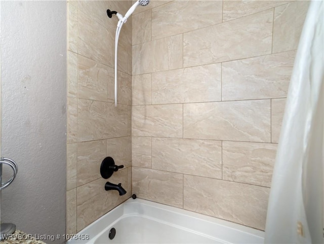 bathroom with shower / bathtub combination with curtain