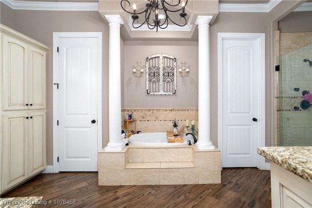 bathroom featuring hardwood / wood-style floors, separate shower and tub, a notable chandelier, crown molding, and vanity