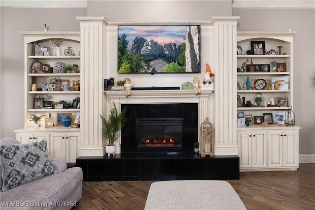 living room with a fireplace and dark hardwood / wood-style floors