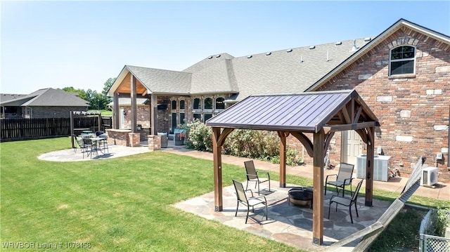 exterior space featuring a gazebo, a patio, ac unit, a fire pit, and central air condition unit