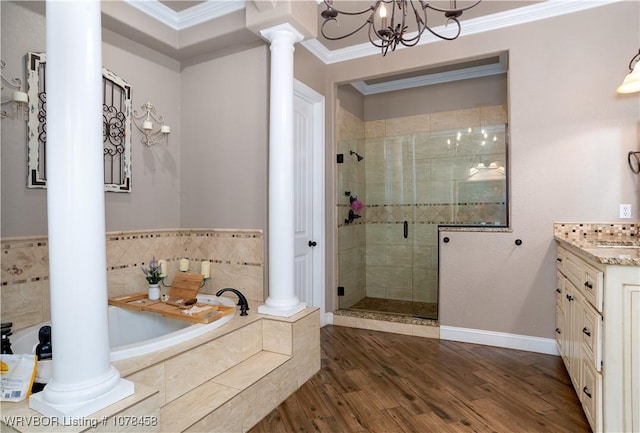 bathroom with separate shower and tub, an inviting chandelier, crown molding, and hardwood / wood-style flooring