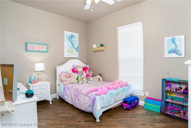 bedroom featuring ceiling fan and dark wood-type flooring