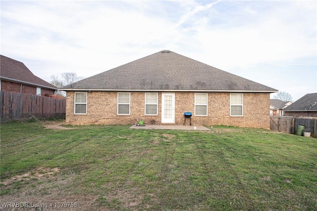 1075 Maple Ridge Dr, Greenwood, AR 72936 - back of house with a yard, brick siding, a fenced backyard, and a patio area