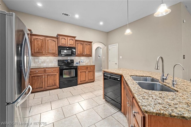 1075 Maple Ridge Dr, Greenwood, AR 72936 - kitchen with brown cabinets, a sink, backsplash, visible vents, and black appliances