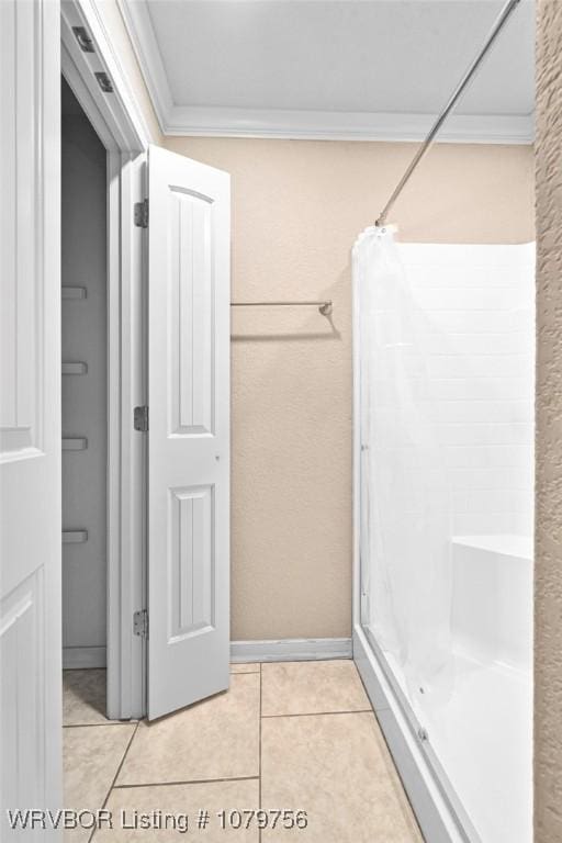 1075 Maple Ridge Dr, Greenwood, AR 72936 - bathroom featuring tile patterned flooring, ornamental molding, and a stall shower