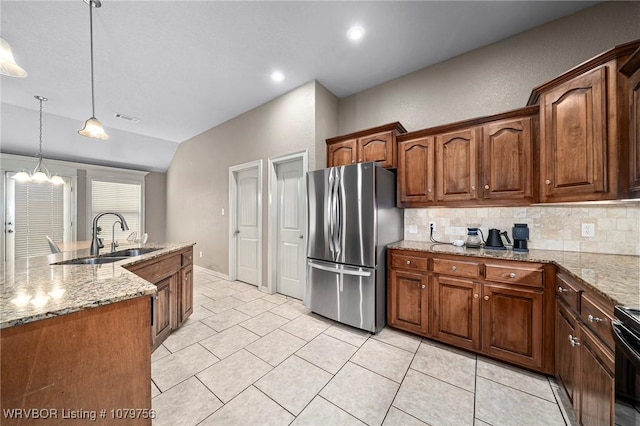 1075 Maple Ridge Dr, Greenwood, AR 72936 - kitchen featuring visible vents, freestanding refrigerator, decorative backsplash, lofted ceiling, and a sink
