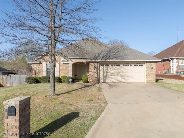 1075 Maple Ridge Dr, Greenwood, AR 72936 - single story home with a garage, fence, a front yard, brick siding, and concrete driveway