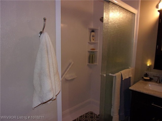 bathroom with vanity and walk in shower