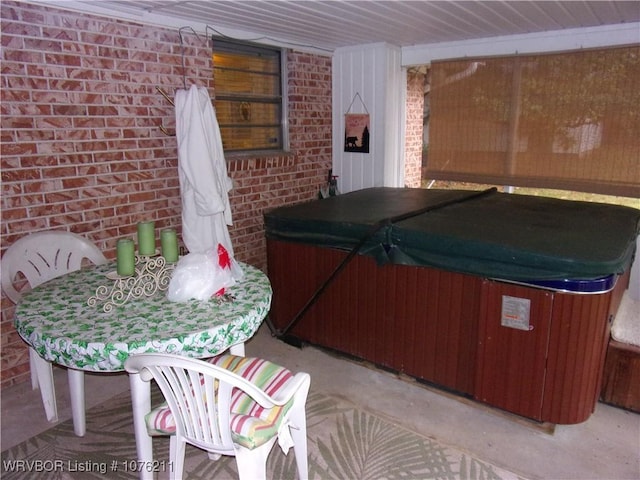 view of patio / terrace with a hot tub