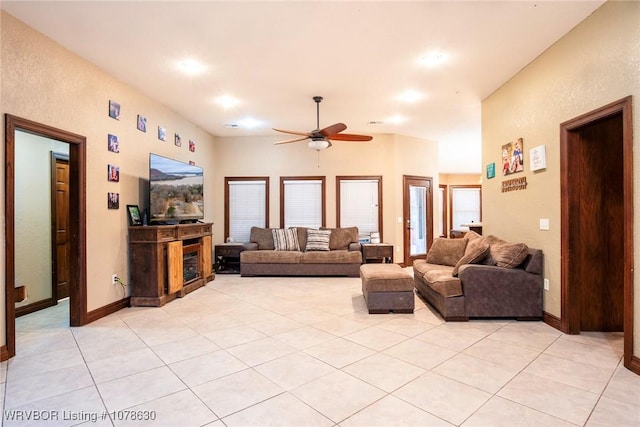 tiled living room with ceiling fan