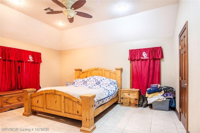 bedroom featuring ceiling fan, tile patterned floors, and vaulted ceiling