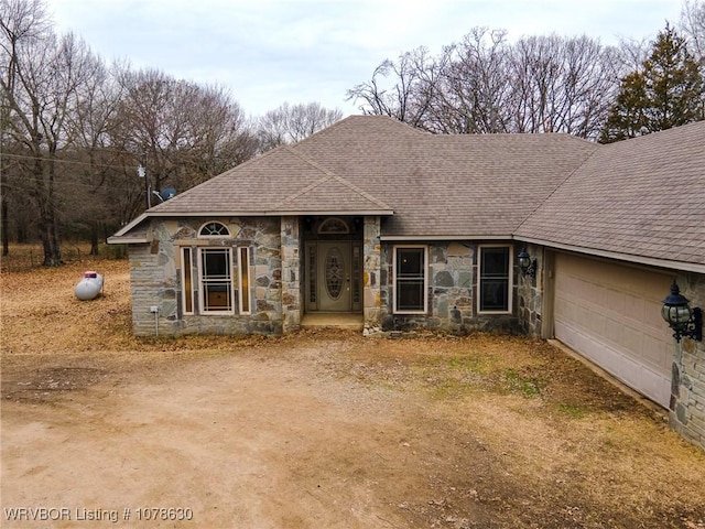 ranch-style house featuring a garage