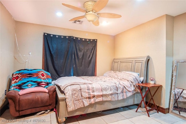 bedroom with light tile patterned floors and ceiling fan