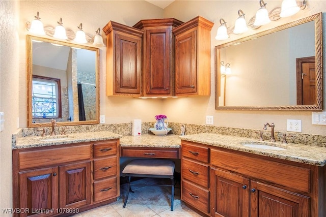 bathroom with vanity, an enclosed shower, and tile patterned flooring