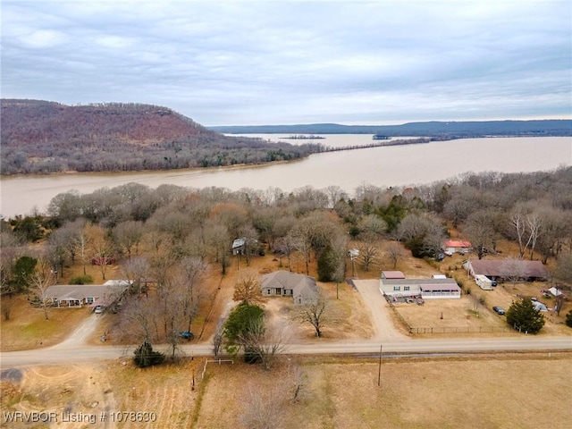 bird's eye view with a water and mountain view