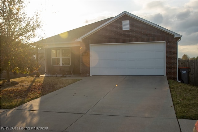 single story home featuring a garage