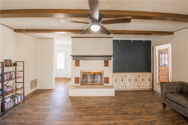 living room featuring visible vents, beamed ceiling, dark wood-style floors, and a ceiling fan