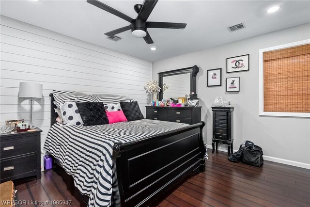 bedroom with ceiling fan and dark wood-type flooring