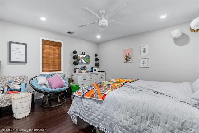 bedroom featuring ceiling fan and dark hardwood / wood-style floors