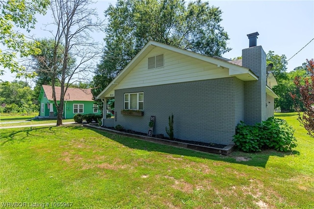 view of home's exterior featuring a lawn