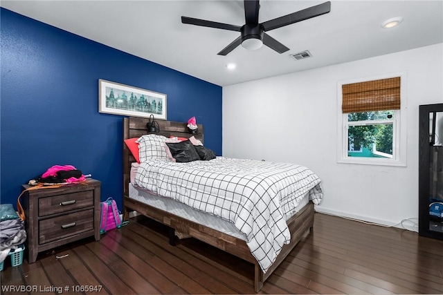 bedroom with ceiling fan and dark hardwood / wood-style floors