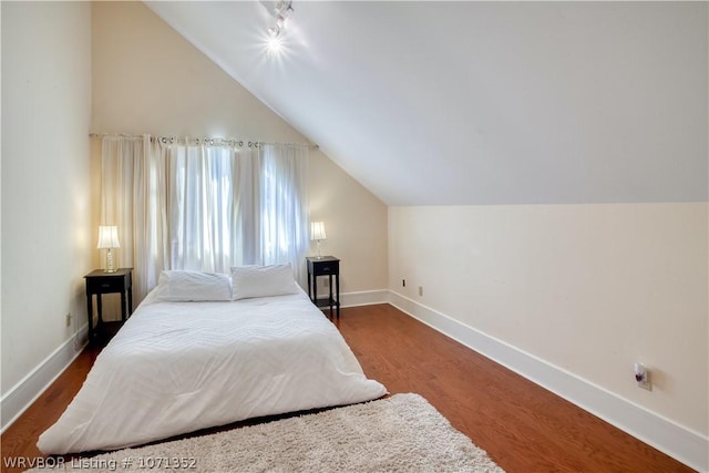 2411 Wyndermere Way, Fort Smith, AR 72903 - bedroom featuring baseboards, wood finished floors, and lofted ceiling