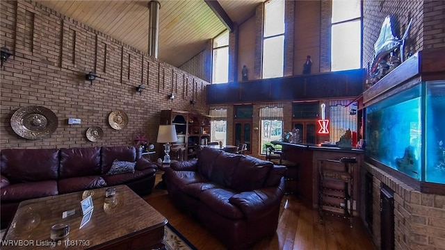 935 County Road 3456, Clarksville, AR 72830 - living room with high vaulted ceiling, wood-type flooring, brick wall, wood ceiling, and a fireplace
