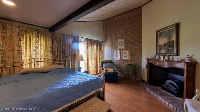 935 County Road 3456, Clarksville, AR 72830 - bedroom with wood finished floors and a fireplace with raised hearth