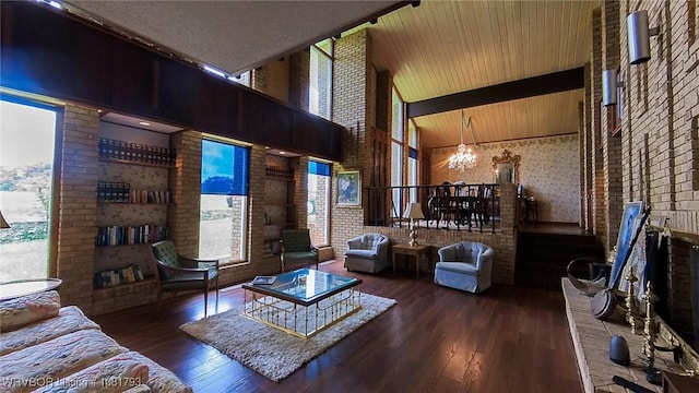 935 County Road 3456, Clarksville, AR 72830 - living area featuring high vaulted ceiling, a chandelier, wood finished floors, beamed ceiling, and wallpapered walls