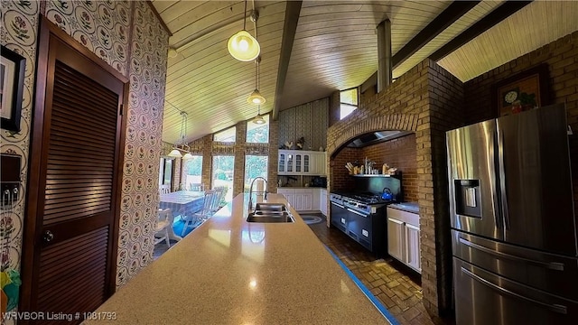 935 County Road 3456, Clarksville, AR 72830 - kitchen with stainless steel fridge with ice dispenser, high vaulted ceiling, wooden ceiling, high end black range, and light countertops