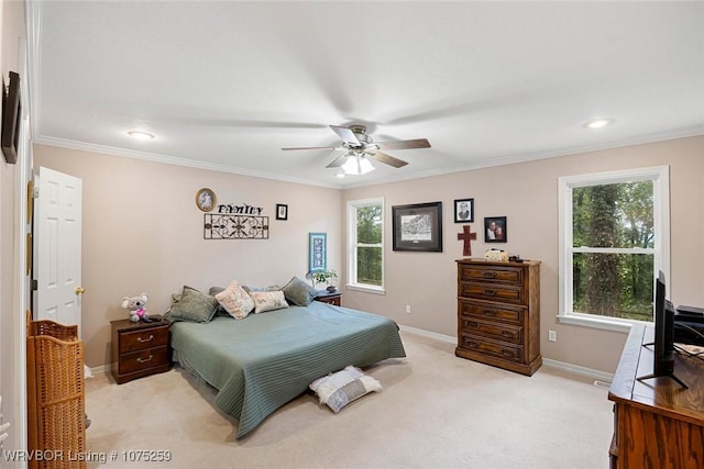 bedroom with ceiling fan, crown molding, and light colored carpet