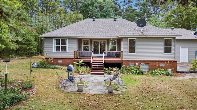 back of property with a patio area, a yard, and a wooden deck